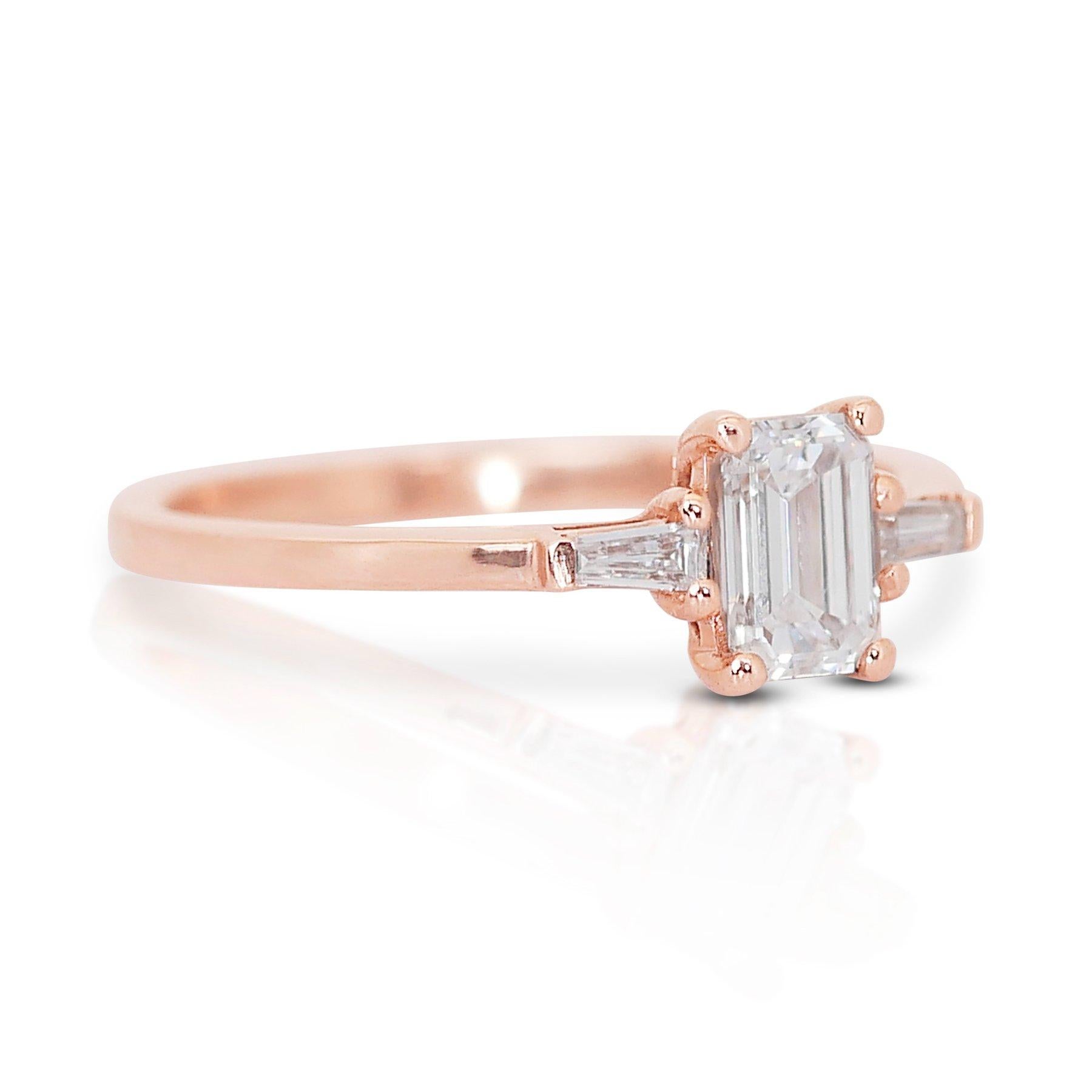 Elegant 0.90ct Emerald-Cut Diamond 3-Stone Ring in 18k Rose Gold - GIA Certified

Step into a world of refined elegance with this exquisite diamond 3-stone ring, meticulously crafted in 18k rose gold. At its heart lies a 0.70-carat emerald-cut