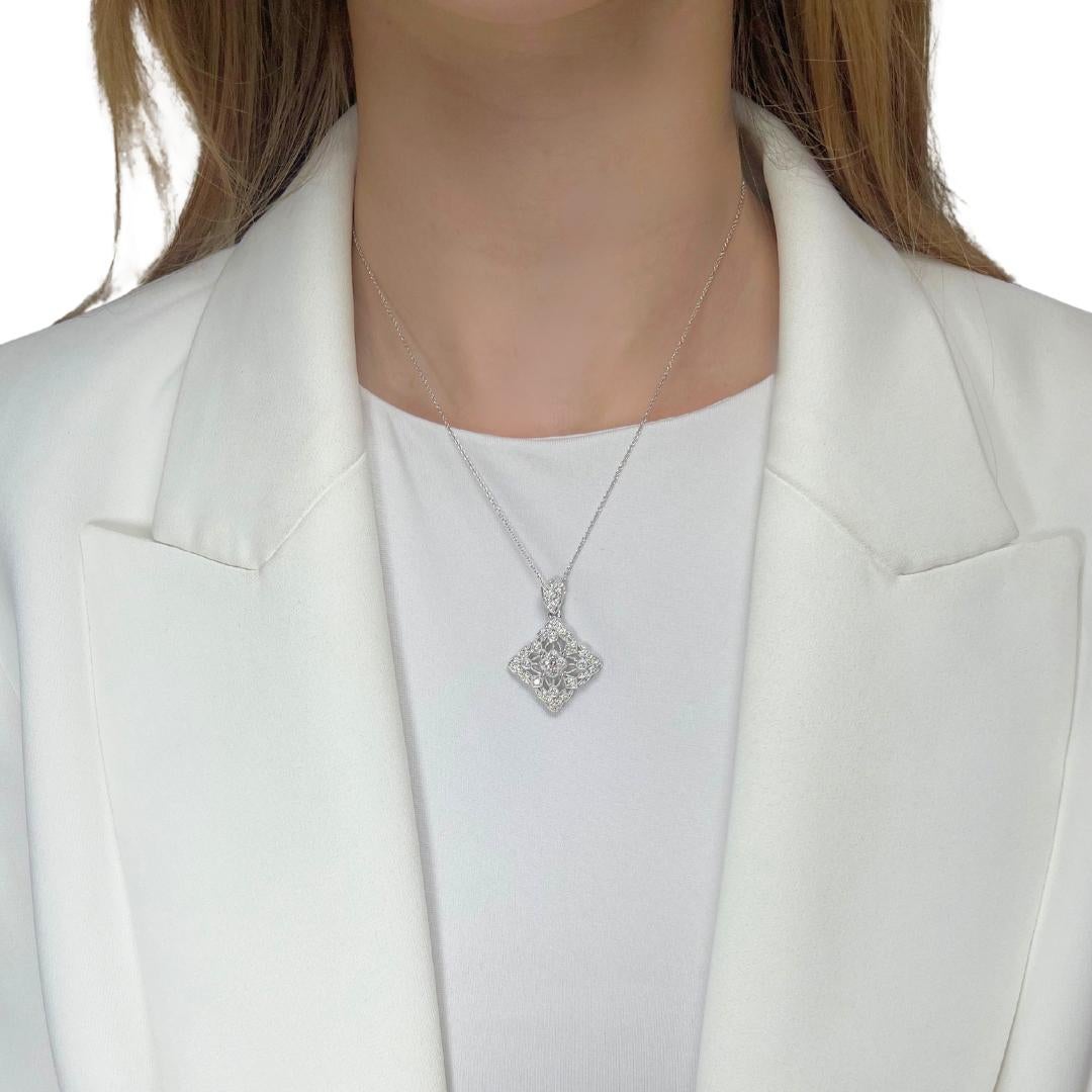Elegant 0.91ct Diamonds Necklace with Pendant in 18k White Gold - IGI Certified

This dazzling 18k white gold necklace features 39 round diamonds with a total carat weight of 0.91ct. Boasting a fine color grade and clarity, these diamonds exude a