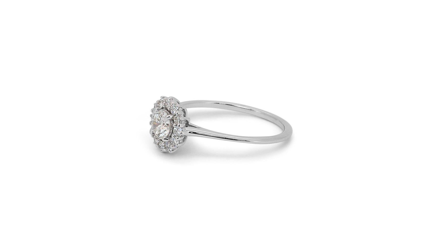 Elegant 0.91ct Triple Excellent Ideal Cut Diamonds Halo Ring in 18k White Gold - GIA Certified

Discover pure brilliance with this exquisite diamond ring, crafted in 18k white gold. The centerpiece is a stunning 0.71-carat round diamond, boasting a