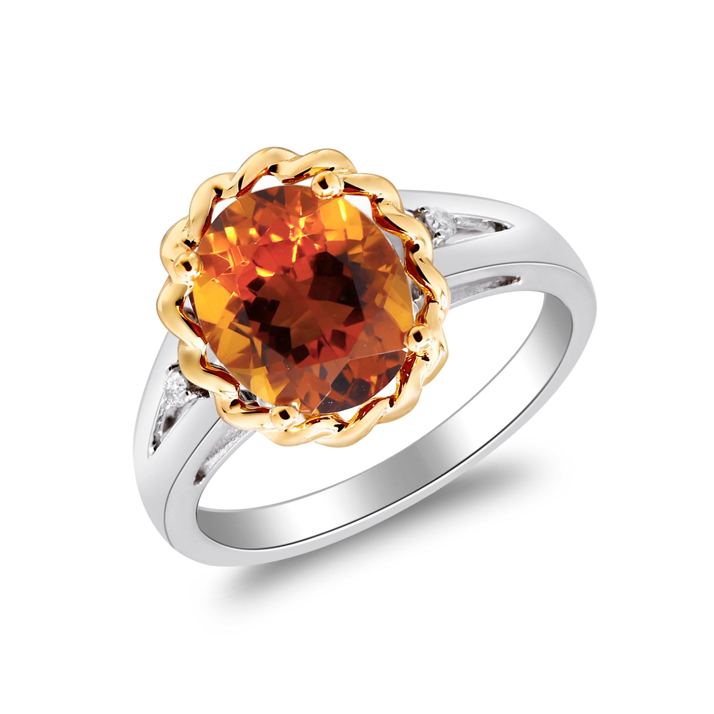 Discover the captivating beauty of this two-tone gold ring, featuring an oval-cut Brazilian citrine weighing 2.37 carats. Crafted with a harmonious blend of 10K gold and 925 silver, this stunning piece showcases a radiant citrine at its center,