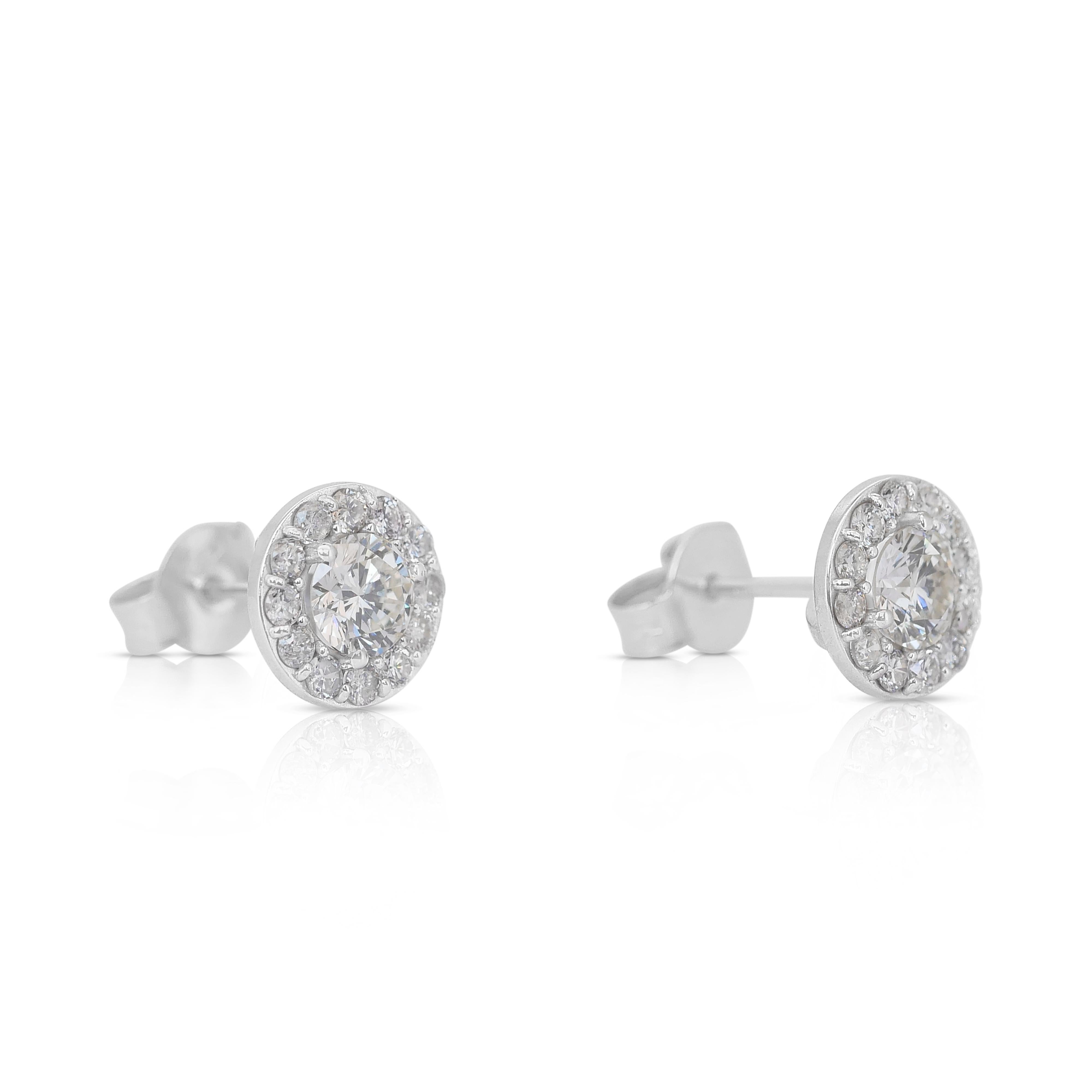 Elegant 1.14ct Diamonds Stud Earrings in 14k White Gold - IGI Certified

Elevate your style with these dazzling diamond halo stud earrings, masterfully crafted in 14k white gold. The centerpiece features two stunning round diamonds, totaling 0.72