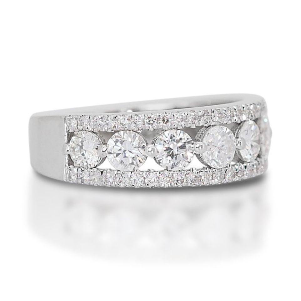 This stunning ring features a dazzling 1.17 carat round brilliant natural diamond, the highest color grade and near flawless clarity. The 46 sparkling side stones, totaling 0.28 carats, add even more brilliance and elegance to the design. Crafted
