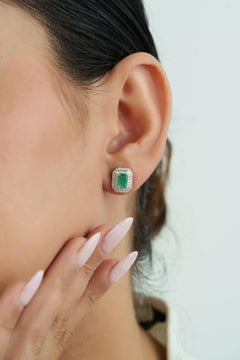 Elegant 1.3 Ct Emerald and Diamond Double Halo Stud Earrings in 14k White Gold