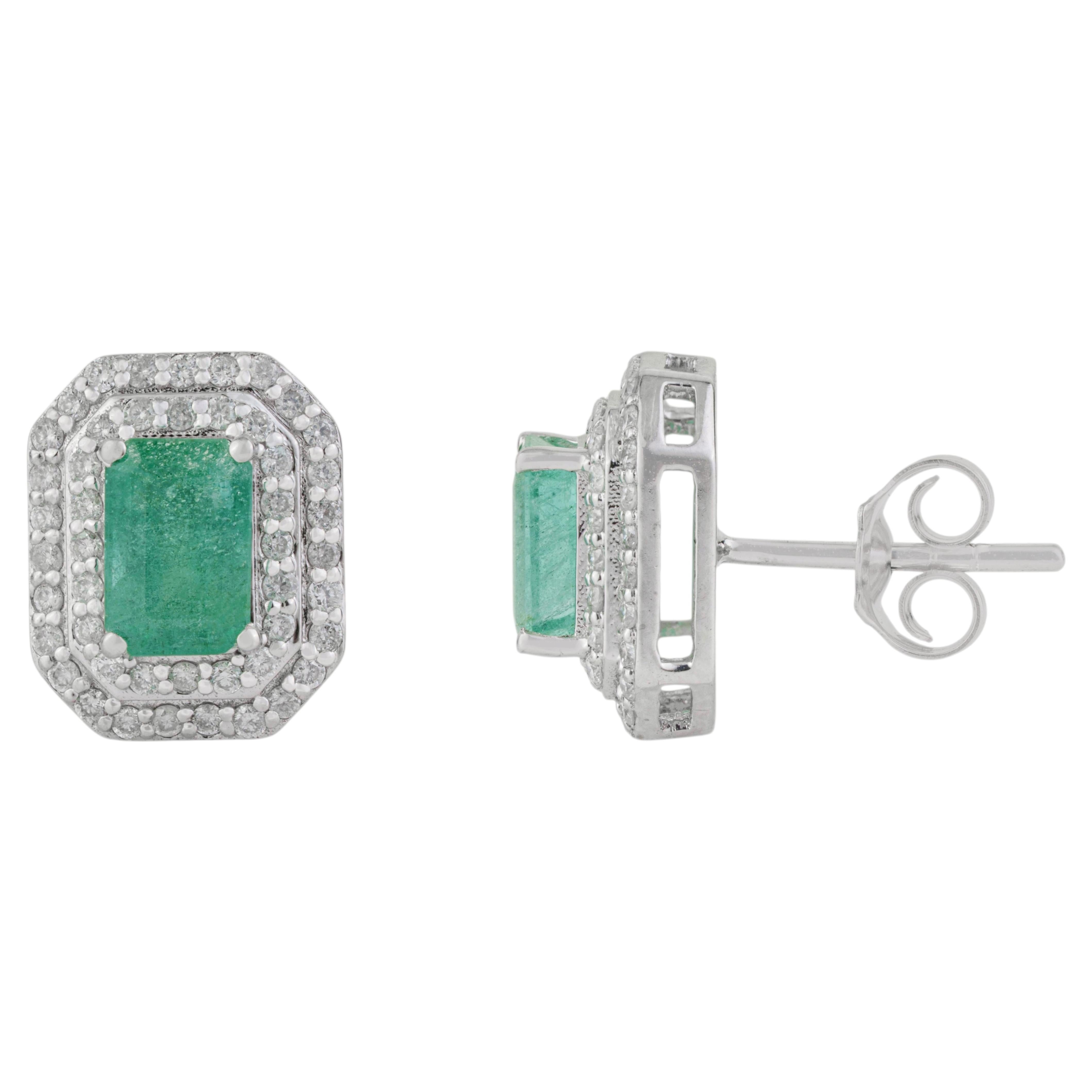 Elegant 1.3 Ct Emerald and Diamond Double Halo Stud Earrings in 14k White Gold