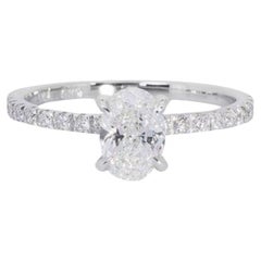 Élégante bague en or blanc 18 carats avec diamant ovale de 1,33 carat