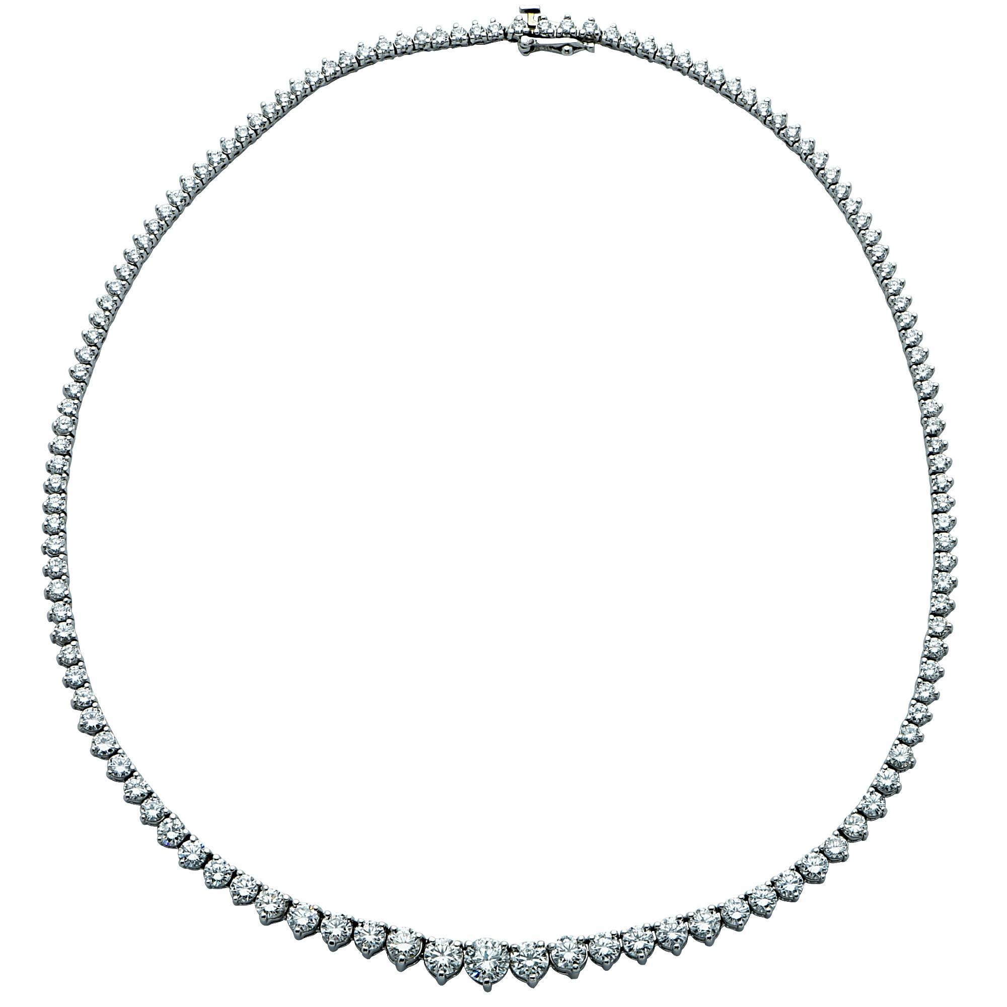 This stunning graduated platinum diamond necklace features approximately 13.50cts total of round brilliant cut diamonds G-H color VS-SI clarity. This riviera necklace is 16.25 inches long, measuring approximately 6.97 mm at its thickest point, and
