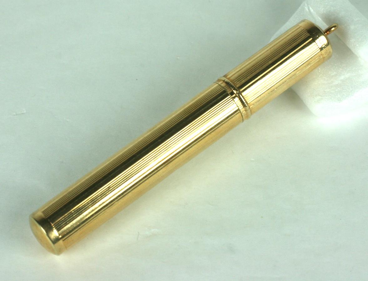 Elegant 14k Deco Gold Lighter from the 1930's. Elegant ribbed design with space for monogram. Top has loop for a watch chain as well. Interior fittings require fuel to function.
Marked 14k on cap. 3.25