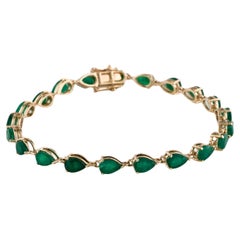 Elegant 14K Gold 7" Emerald Link Bracelet with 6.93ct Pear-Shaped Gems