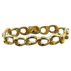 Elegant 14K Gold Bracelet with Interlocking Oval Links and Colorful Gemstones