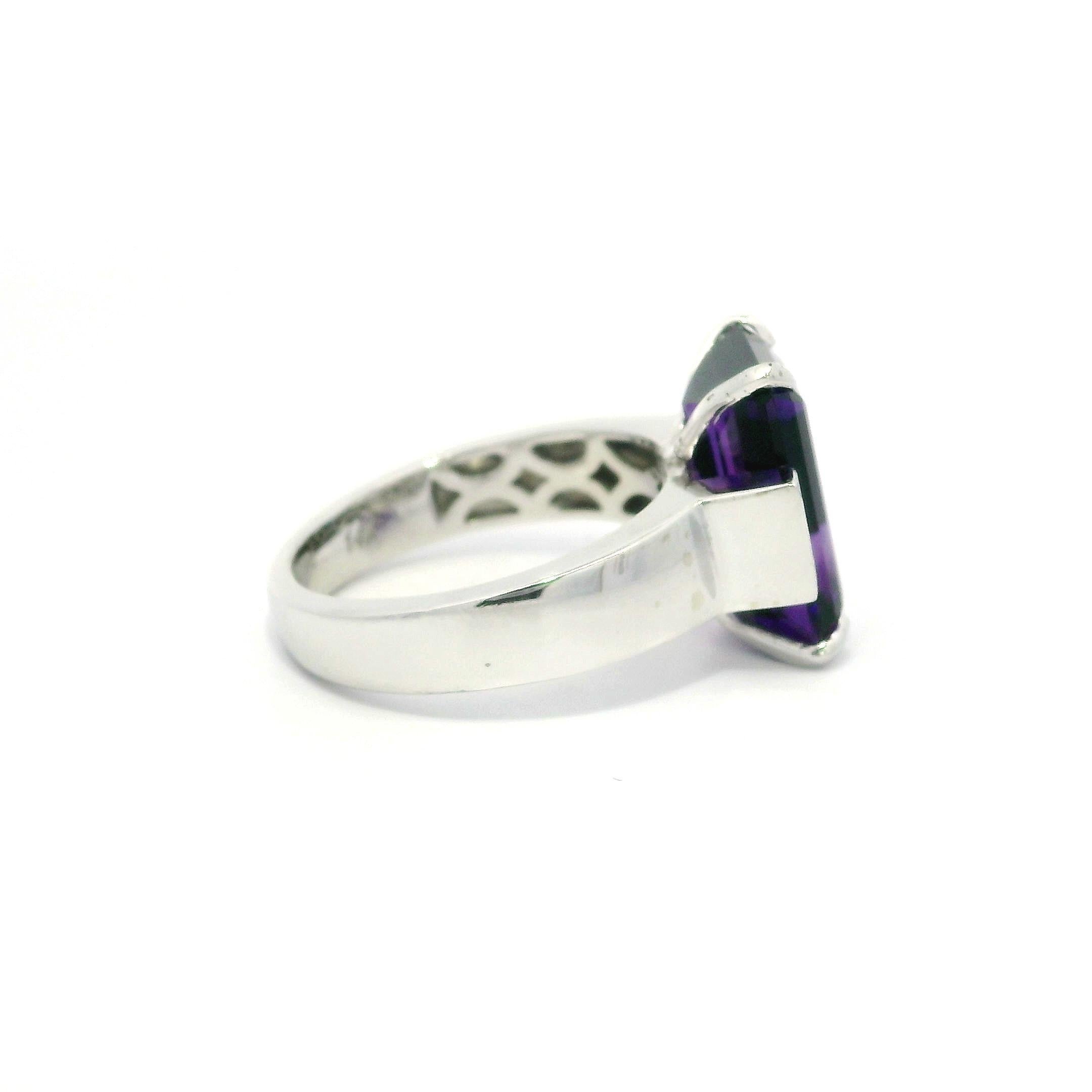 –Stone(s)–
(1) Natural Genuine Amethyst - Rectangular Step Cut -Prong Set - Deep Purple Color - 13.9x9.1mm (approx.) - 5.6ct (exact)
(8) Natural Genuine Diamonds - Round Brilliant Cut - Pave Set - F/G Color - VS1/VS2 Clarity - 0.08ctw (exact)
Total