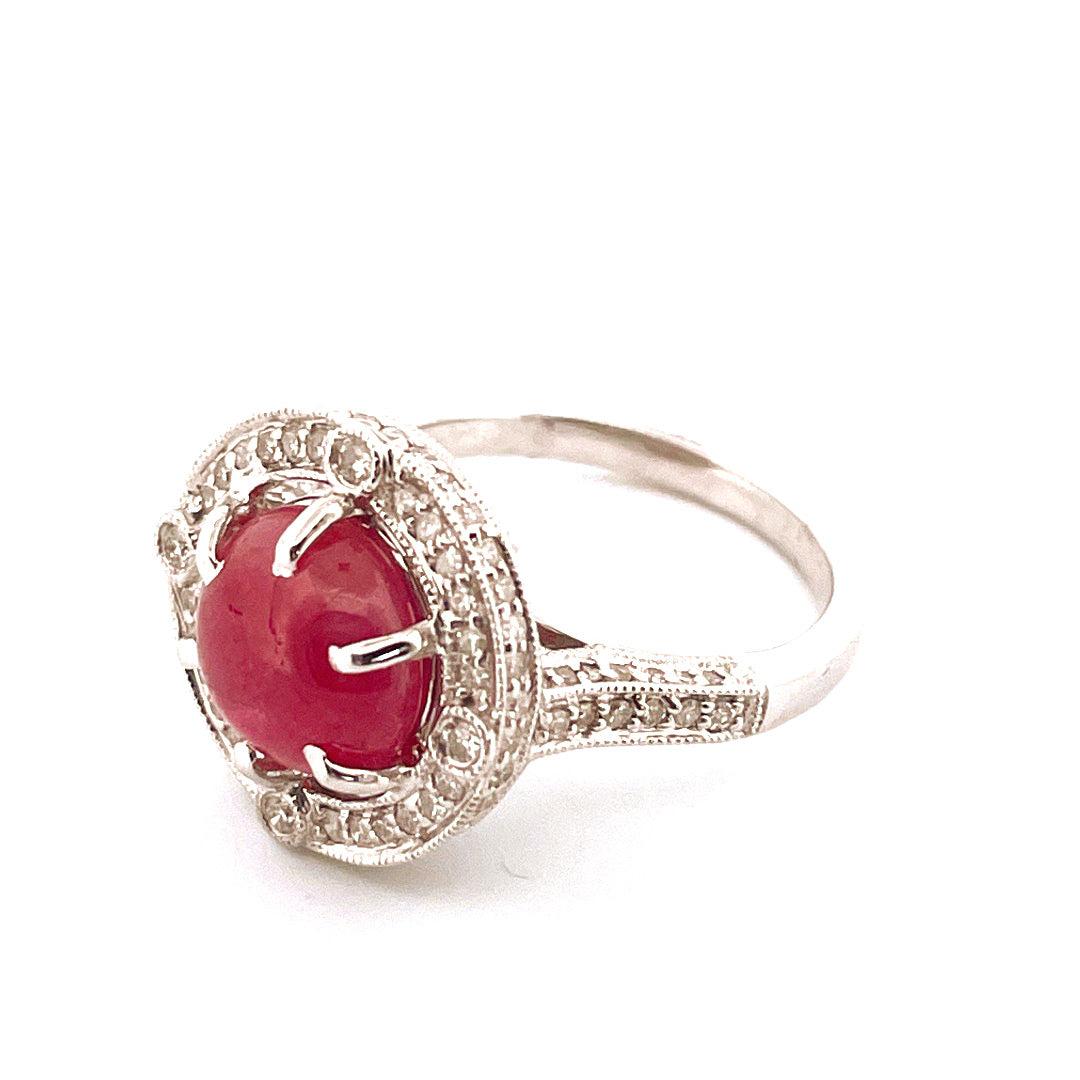 This 14K white gold ring features a classic design, 
with a vibrant ruby accents on centerpiece and 
beautiful 0.6cts diamonds surrounded to it and 
. The band has a total weight of 6.80g, giving it a luxurious feel.
