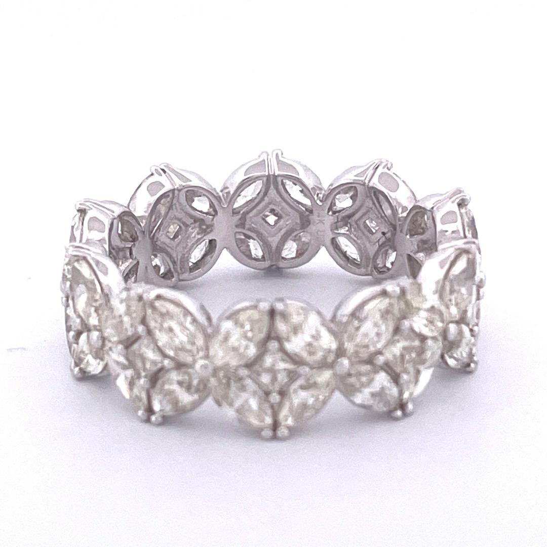 Adorn your finger with this elegant 14k white gold diamond ring featuring a mesmerizing design. The ring boasts nine circles, each adorned with four marquise diamonds on the border, at the center of this enchanting arrangement lies a dazzling square