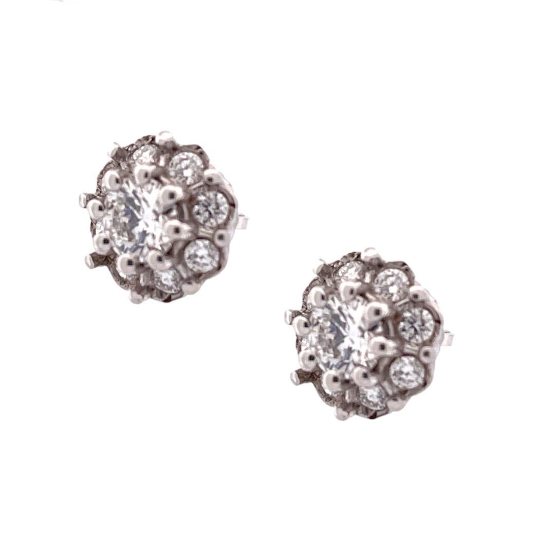 Elegant 14k White Gold Round Diamond Stud Earrings 

Add a touch of elegance to your ensemble with our Elegant Round Diamond Stud Earrings in 14k white gold. These stud earrings feature a dazzling arrangement of seven round-cut diamonds, totaling