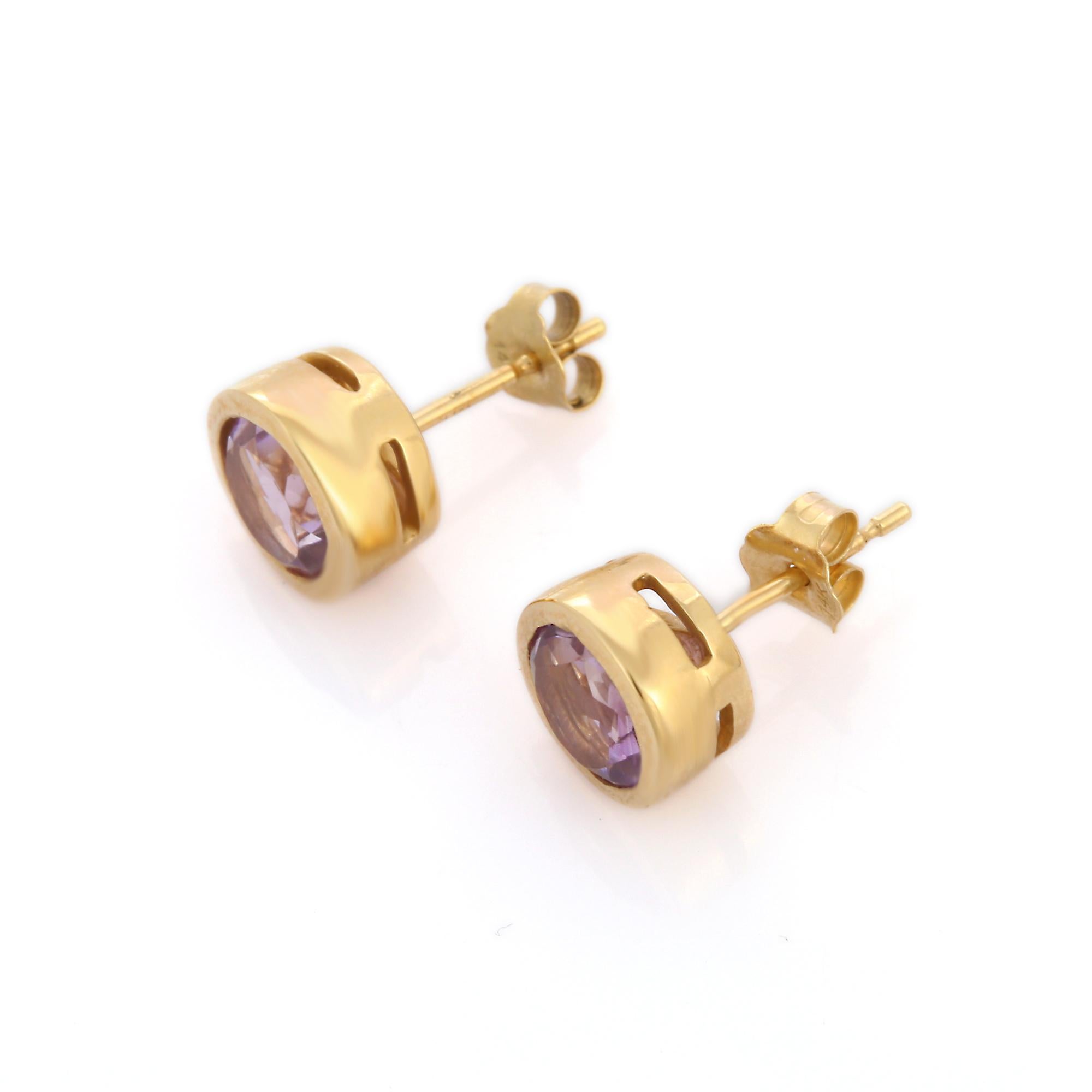 Studs create a subtle beauty while showcasing the colors of the natural precious gemstones.

Dainty round cut amethyst studs in 14K gold. Embrace your look with these stunning pair of earrings suitable for any occasion to complete your