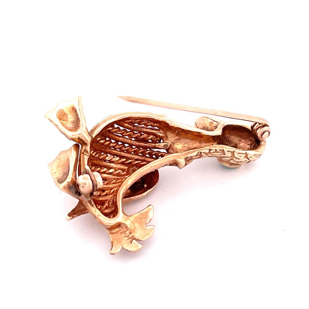 Embrace the grace and elegance of our 14K yellow gold Duck Brooch.This exquisite piece depicts a duck in a graceful standing position, duck's eyes are adorned with striking emerald gemstone, adding a touch of vibrant allure to the design.  Crafted