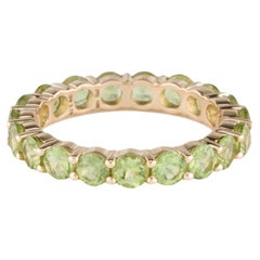  Elegant 14K Yellow Gold Peridot Eternity Band with Faceted Round Peridots