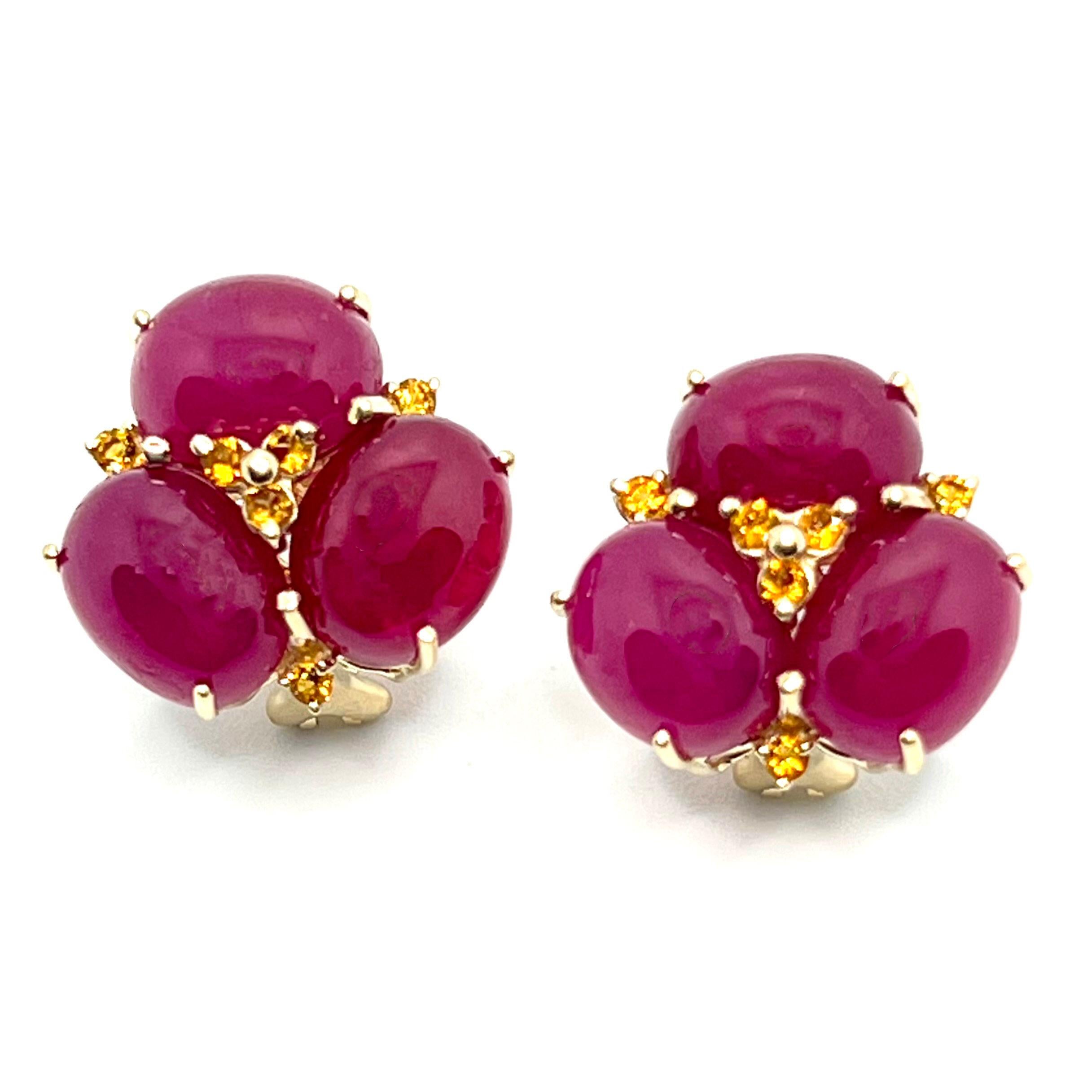 These stunning pair of earrings feature sets of oval cabochon-cut African Ruby adorned with round Brazilian citrine, handset in 14k yellow gold. The oval ruby stones have rich red hue and produce beautiful shiny reflection. Straight post with omega