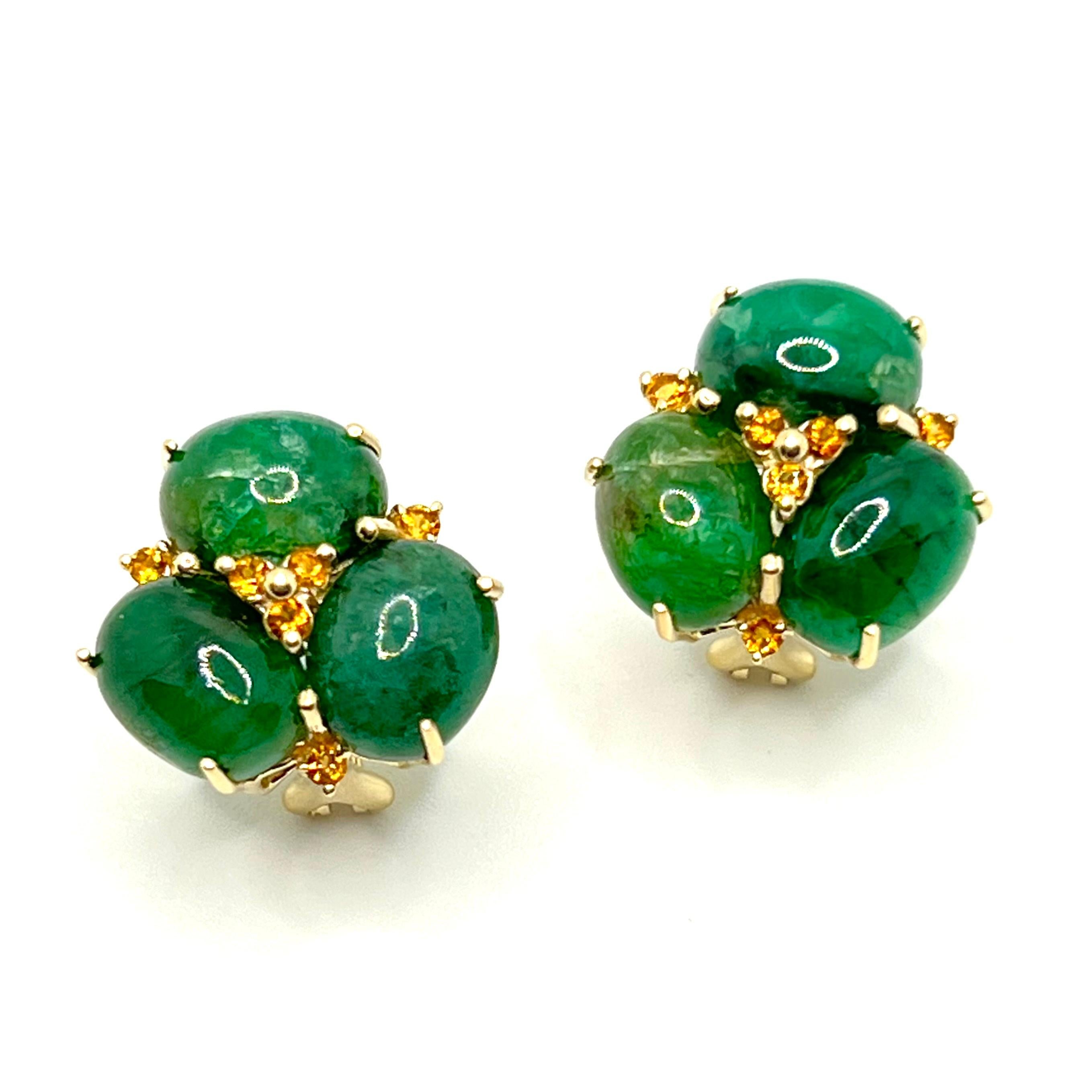 These stunning pair of earrings feature sets of oval cabochon-cut African green emerald adorned with round Brazilian citrine, handset in 14k yellow gold. The oval emerald stones have rich green hue and produce beautiful shiny reflection. Straight