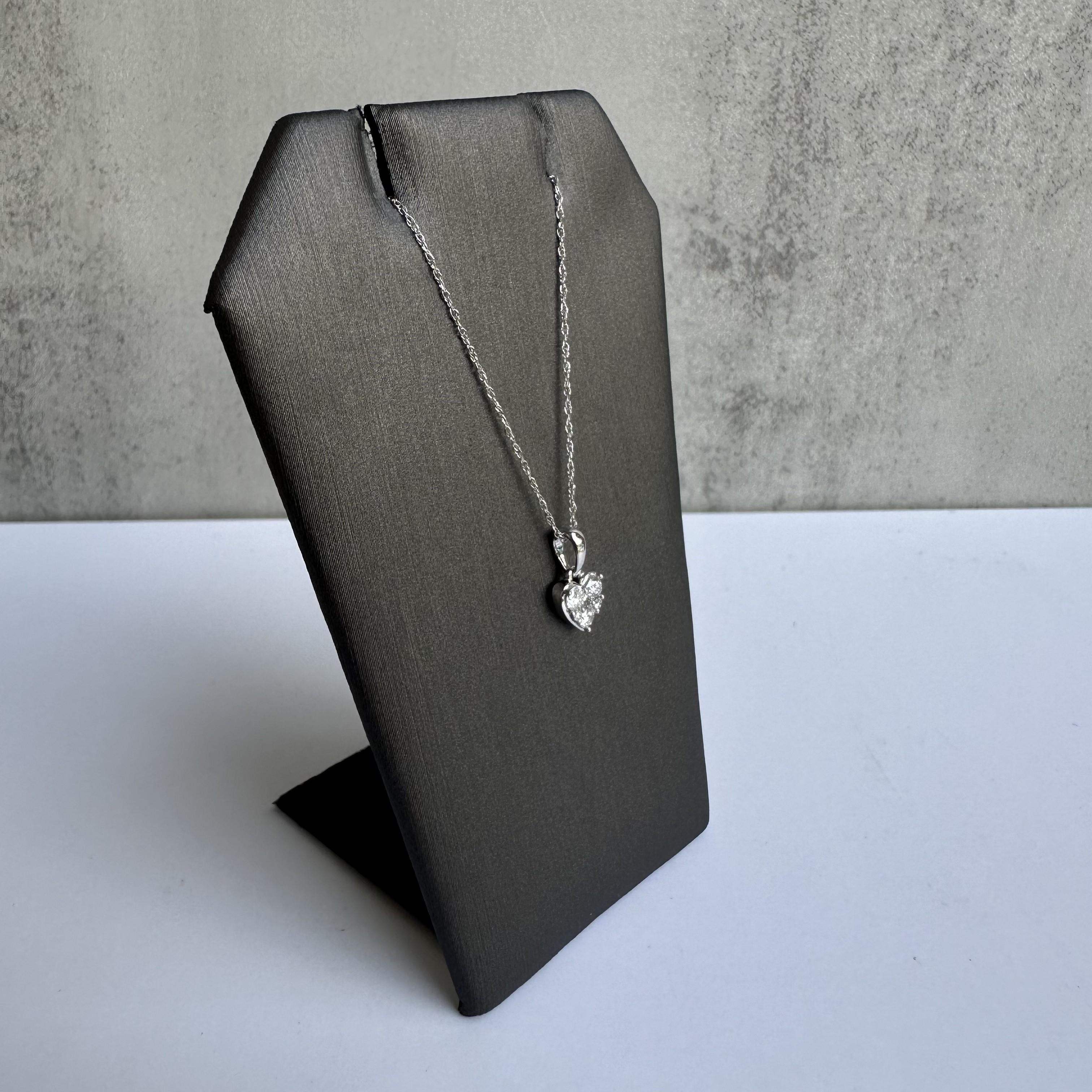 Celebrate love and elegance with this stunning 14kt White Gold Diamond Heart Necklace, featuring a beautifully crafted heart pendant accented with 0.25 carats of GH SI2-I1 diamonds. Perfect for special occasions or everyday wear, this necklace adds