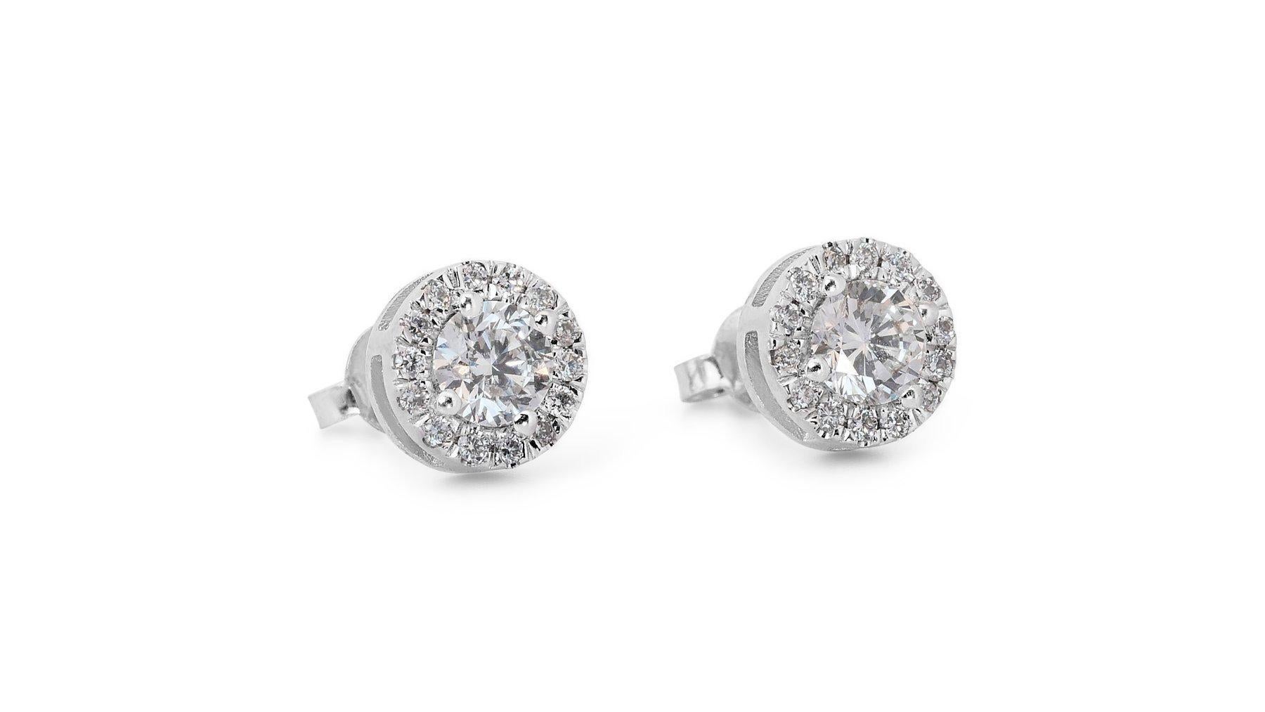 Elegant 1.68ct Diamond Halo Stud Earrings in 18k White Gold - GIA Certified

Experience luxury with these stunning 18k white gold diamond halo stud earrings. The main stones consist of two exquisite round diamonds with a total carat weight of