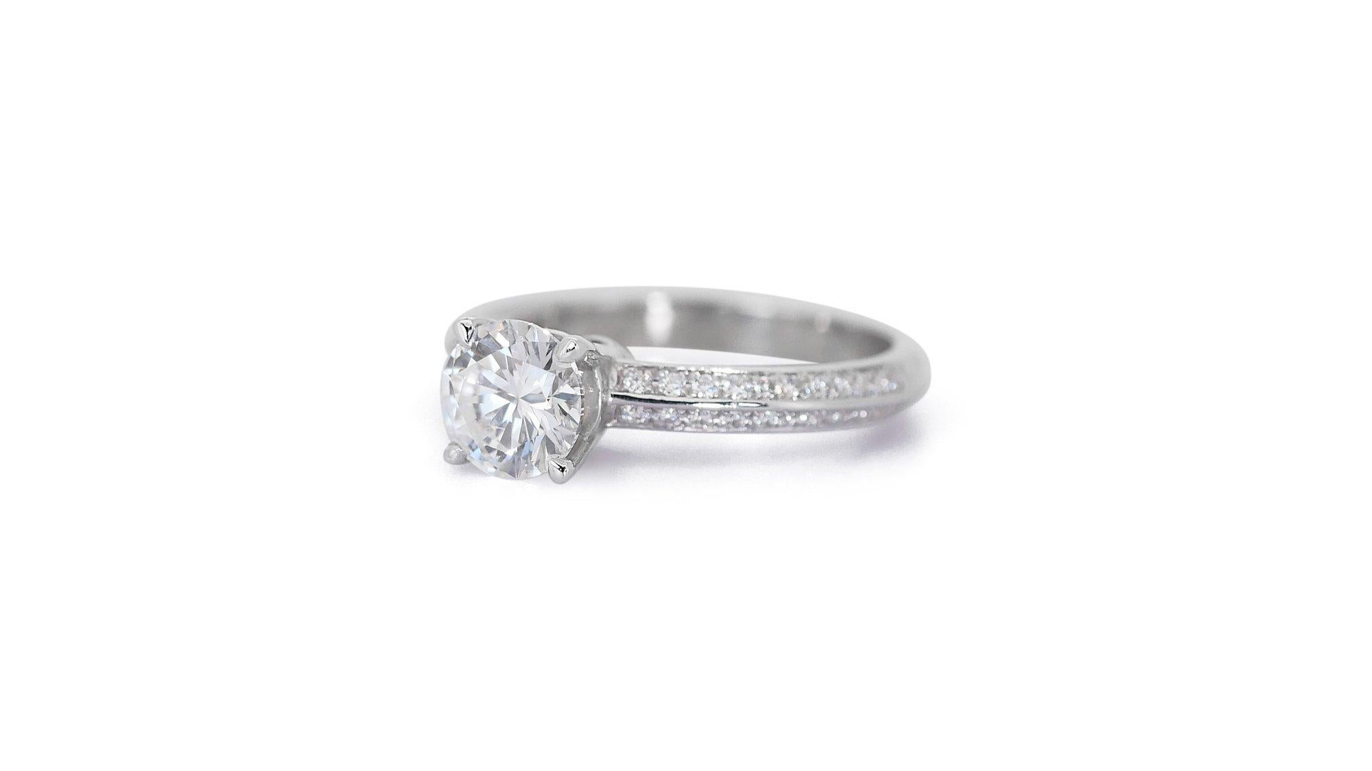 Elegant 1.77ct Triple Excellent Ideal Cut Diamonds Pave Ring in 18k White Gold - GIA Certified

Embrace unparalleled luxury with this exquisite 18k white gold pave ring, featuring a magnificent 1.02-carat round diamond at its center. This