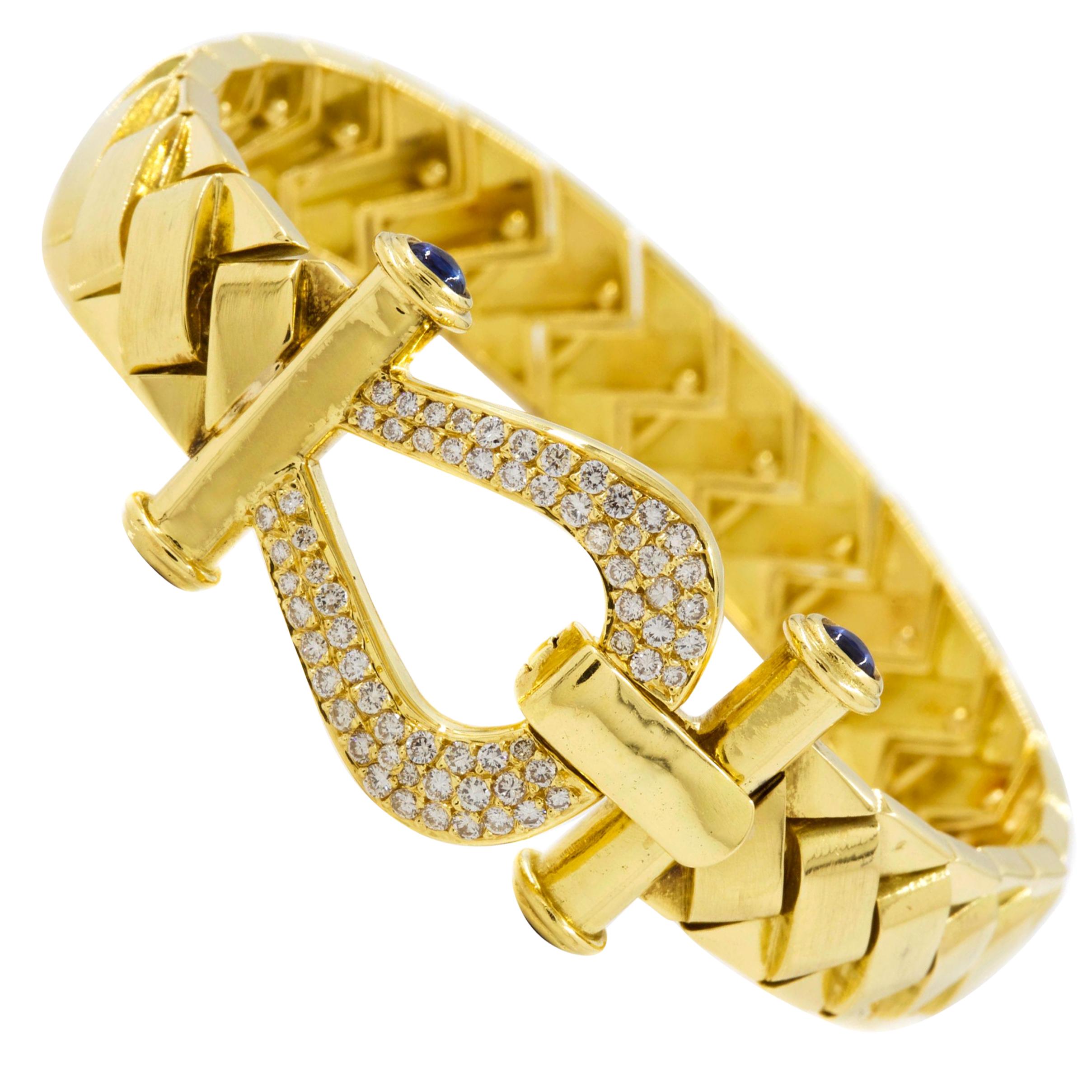 Elegant 18-Karat Gold Woven Strap Bracelet with 65 Diamonds and 4 Sapphires