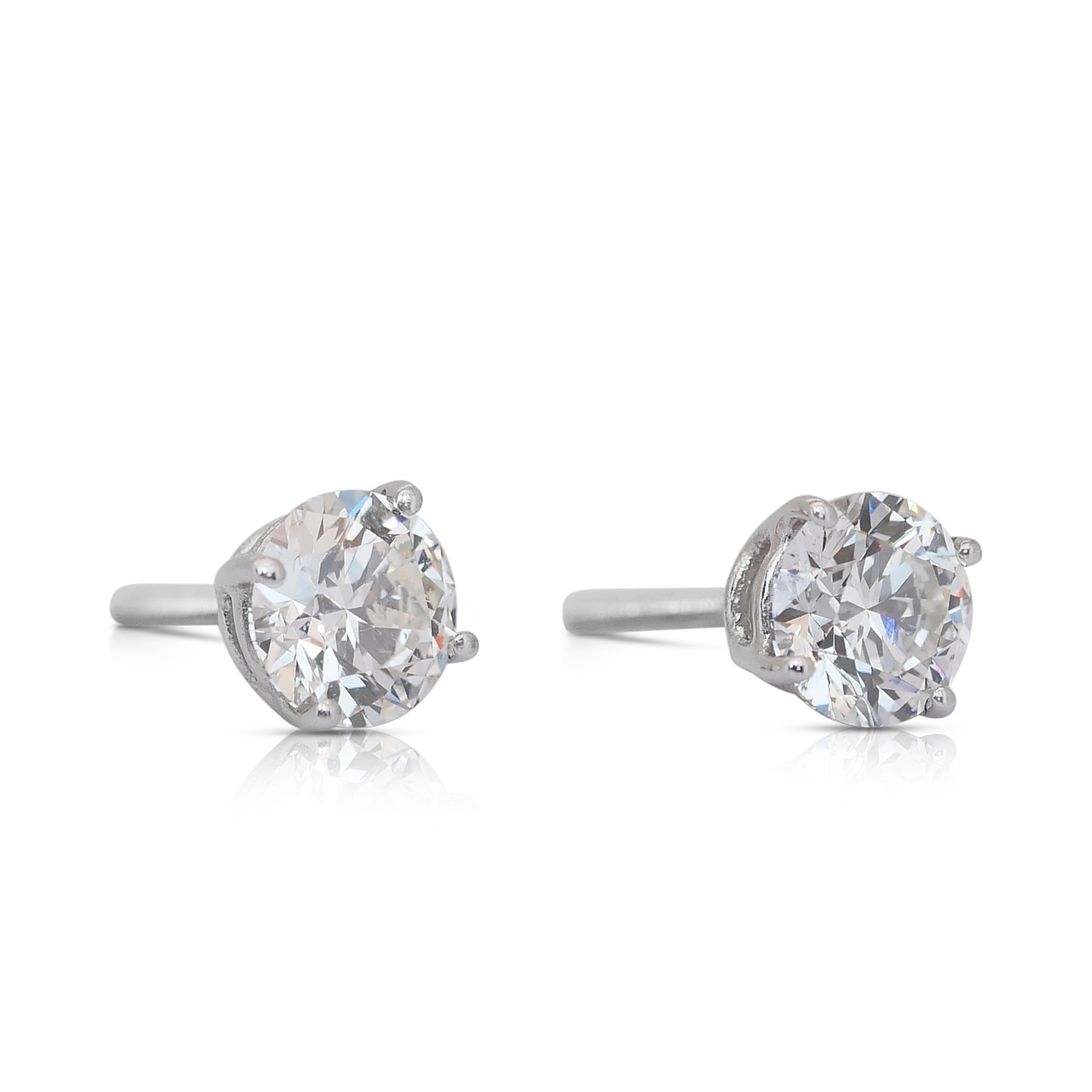 Elegant 1.85ct Diamonds Stud Earrings in Platinum - IGI Certified

Elevate your elegance with these exquisite platinum diamond stud earrings. These earrings are the epitome of sophistication, featuring two stunning round diamonds totaling