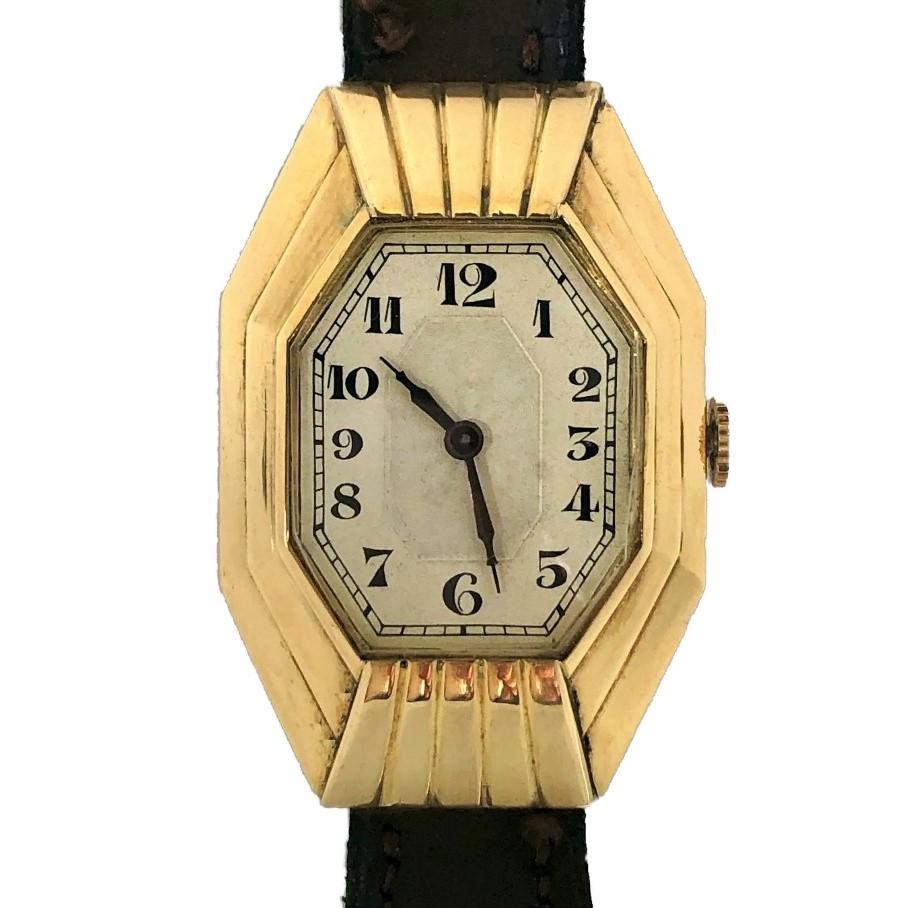 This wonderful authentic French Art-Deco period curvex wristwatch measures a full 1 1/2 inches by 1 1/16 making it a really grand scale time piece. It is done in an architectural style and has it's original Arabic Numeral dial which is in very nice