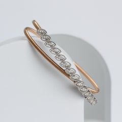 Elegant 18K Gold Spring Bangle Adorned with Natural Diamonds