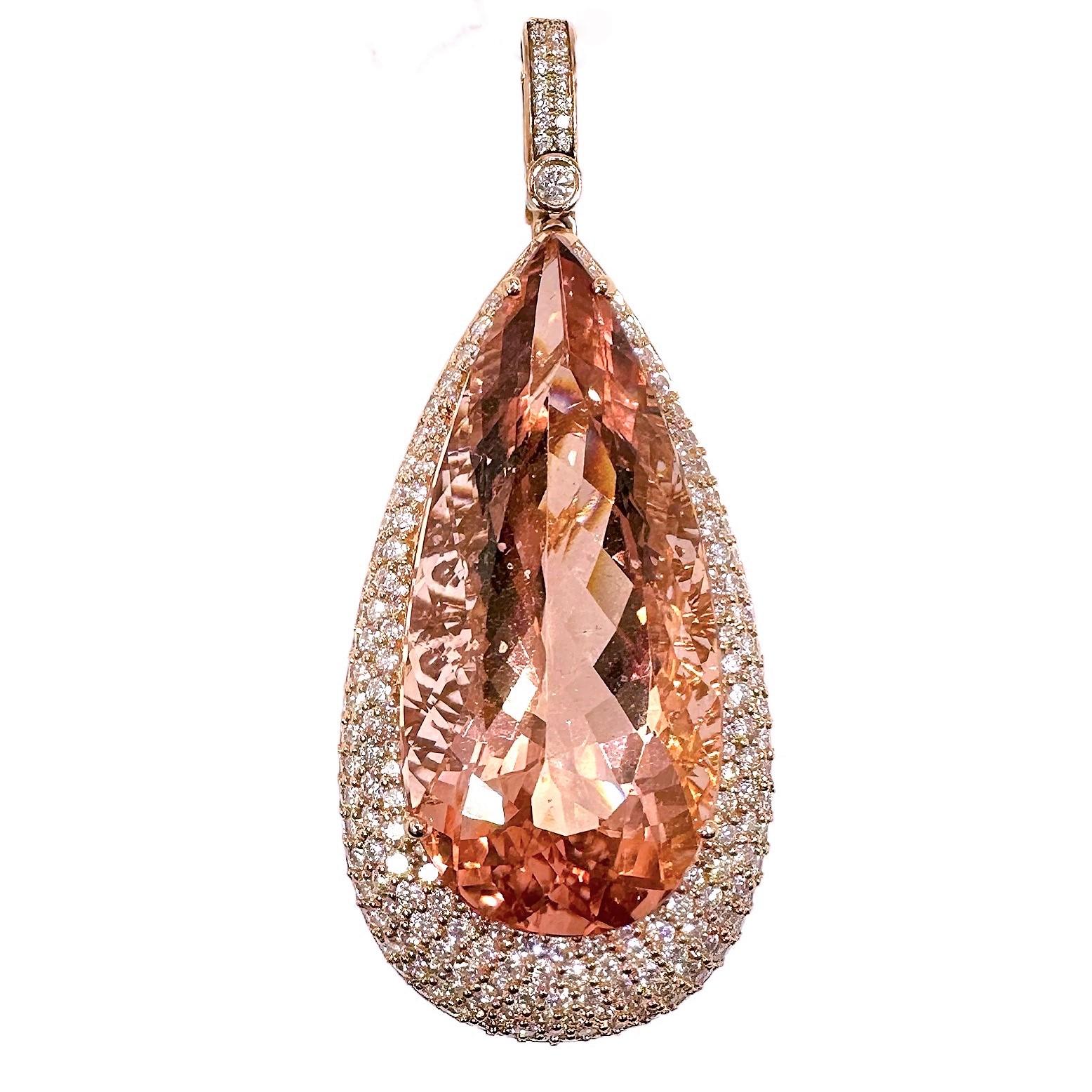 This beautifully designed and crafted 18K rose gold pendant is set with one center opulently sherry colored, pear shaped, faceted, Morganite weighing approximately 40.00ct.  Surrounding the center Morganite are hundreds of precision set round