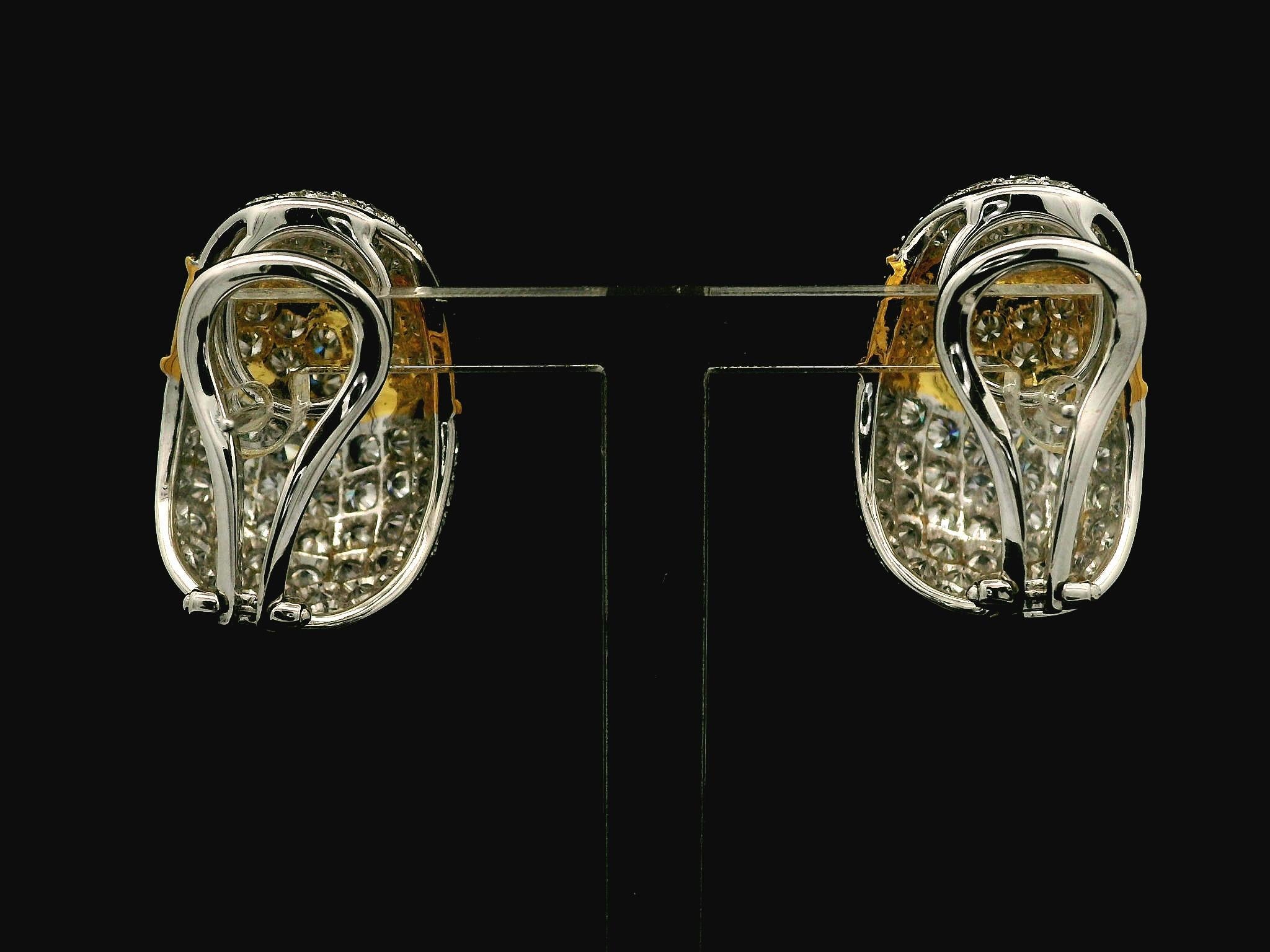 –Stones–
178 Natural Genuine Diamonds - Round Brilliant Cut - Pave Set - Fiery F/G Color - VS1/VS2 Clarity - 7.46ctw exact

Material: 18k Yellow & White Gold 
Weight: 17.8 Grams
Backing: Posts w/ Omega Closure (Pierced ears are required.)
Overall