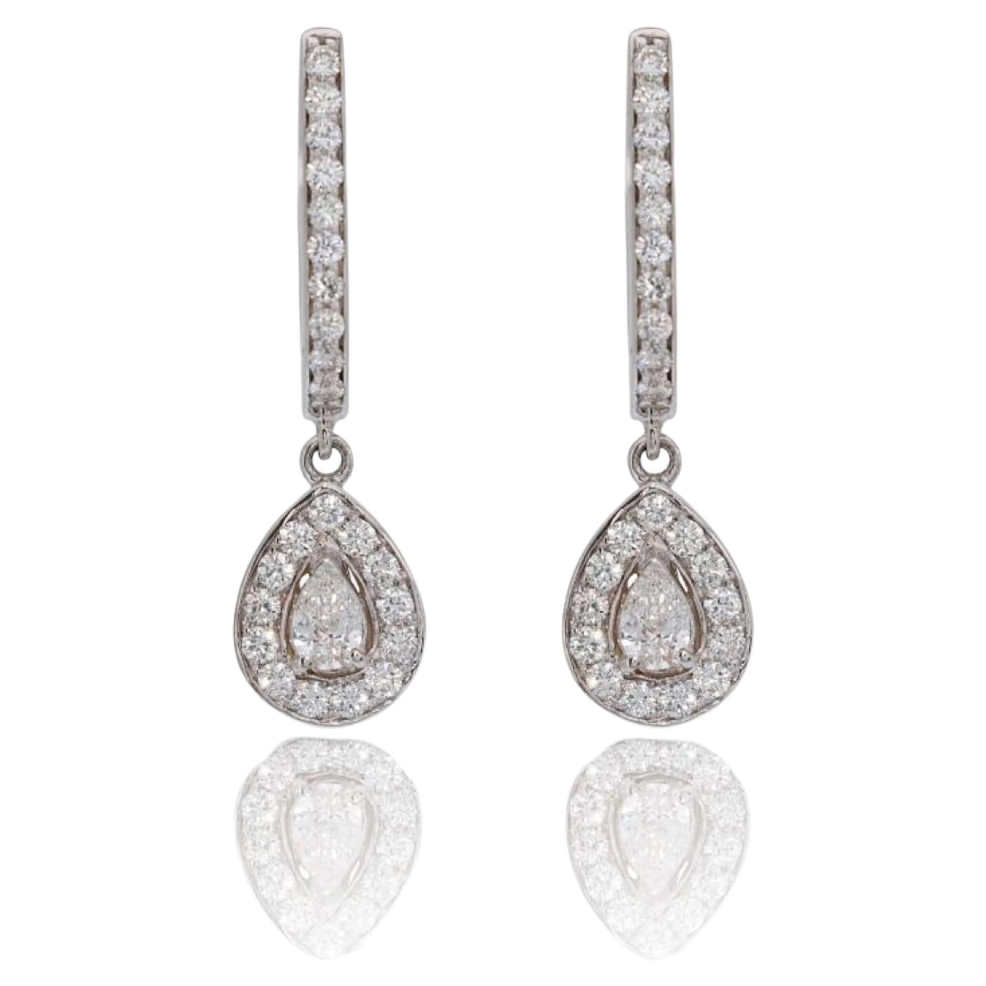 Elegant 18k White Gold .38ct. Pear Brilliant Dangling Diamond Earrings For Sale