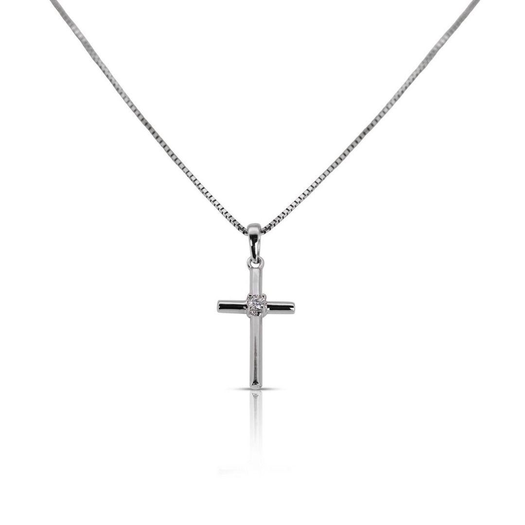 This elegant cross necklace is a beautiful and meaningful piece of jewelry. The cross pendant is crafted from sterling silver in a sleek, minimalist style. Two thin bars come together in the shape of a cross, with clean lines and a polished, shiny