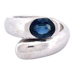 Elegant 18k White Gold Crossover Sapphire Ring