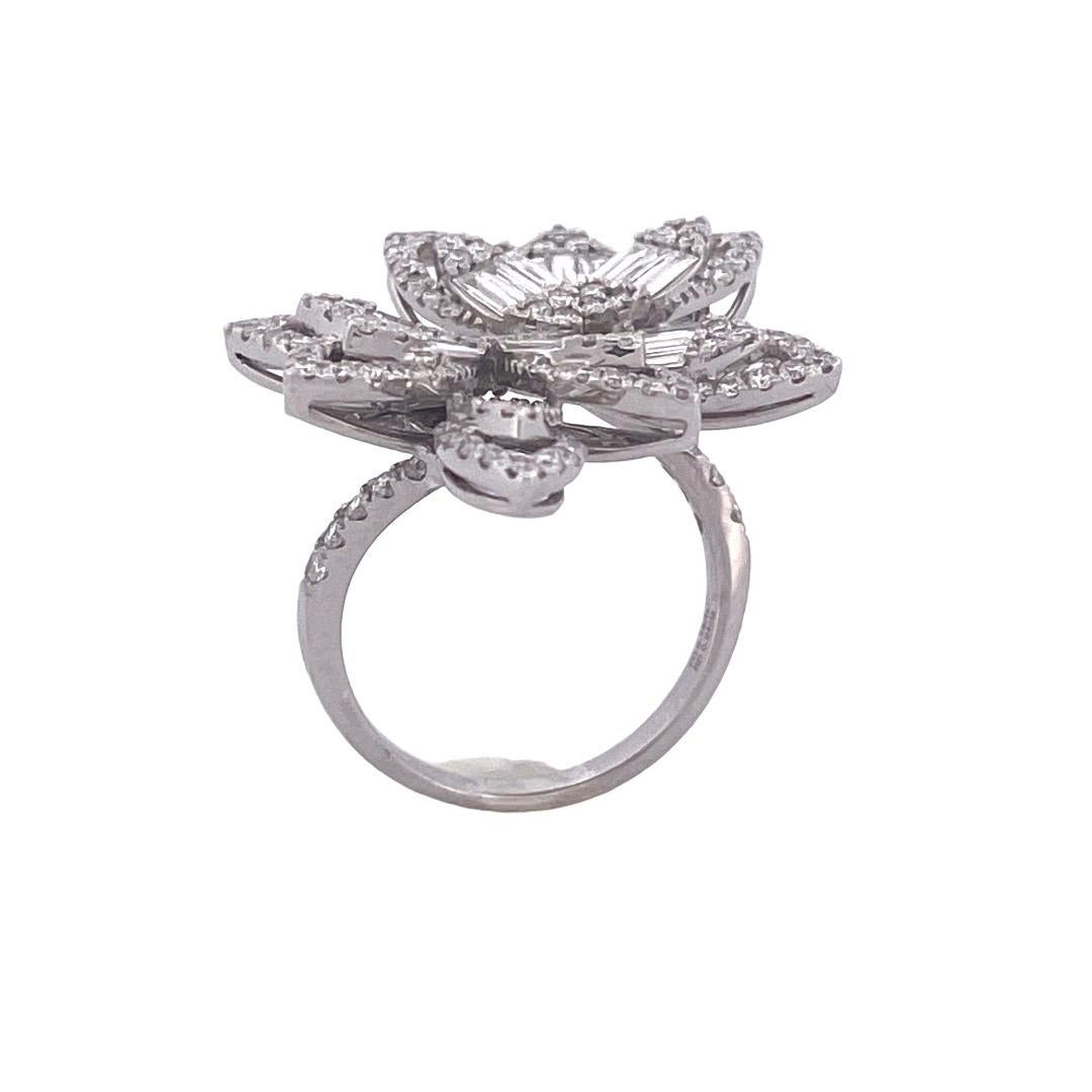 Enhance your style with this stunning 18k white gold diamond ring featuring a unique four-leaf cluster design on both ends. The ring boasts a total of 146 brilliant round cut diamonds, totaling 0.94 carats, beautifully arranged in clusters.