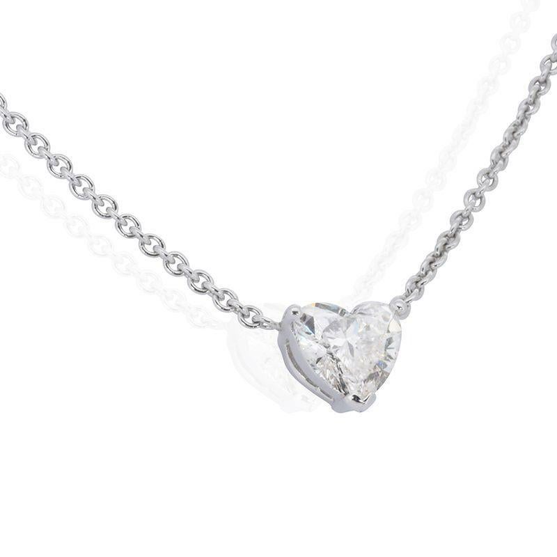 Capture love's eternal brilliance with this exquisite necklace, featuring a captivating 1 carat heart-shaped diamond. Bathed in near-colorless E color and boasting near-flawless VS1 clarity, this diamond radiates with exceptional fire and beauty,