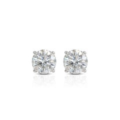 Eleganti orecchini a perno in oro bianco 18K
