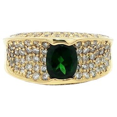 Eleganza in oro giallo 18 carati: fascia con tsavorite ovale da 2,23 carati e pavé di diamanti