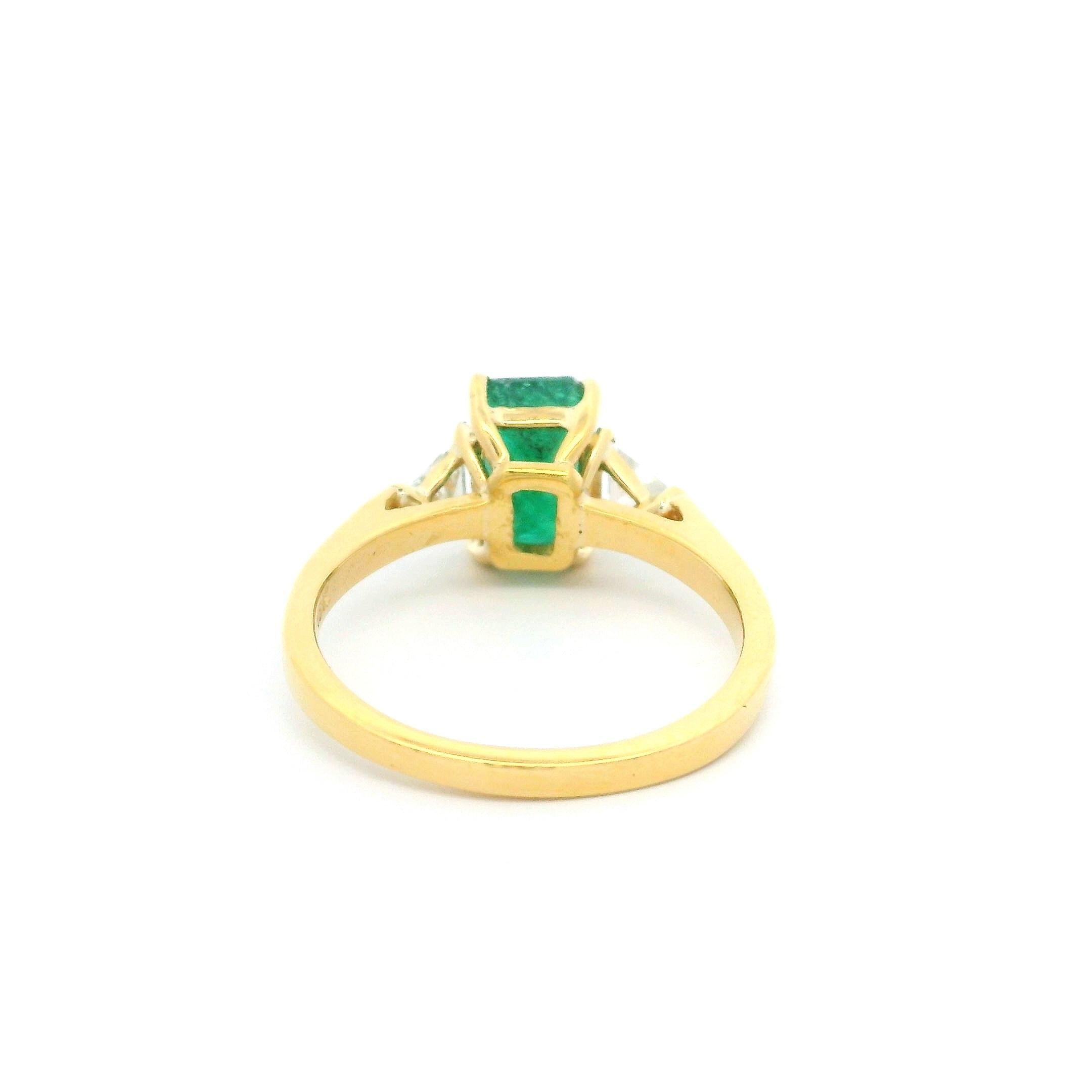 --Stone(s):--
(1) Natural Genuine Emerald - Elongated Emerald Cut - Prong Set - Deep Green Color w/ Natural Inclusions - 8.4x5.5mm - 1.80ct (approx.)
(2) Natural Genuine Diamonds - Trillion Step Cut - Prong Set - H/I Color - SI1/SI2 Clarity -