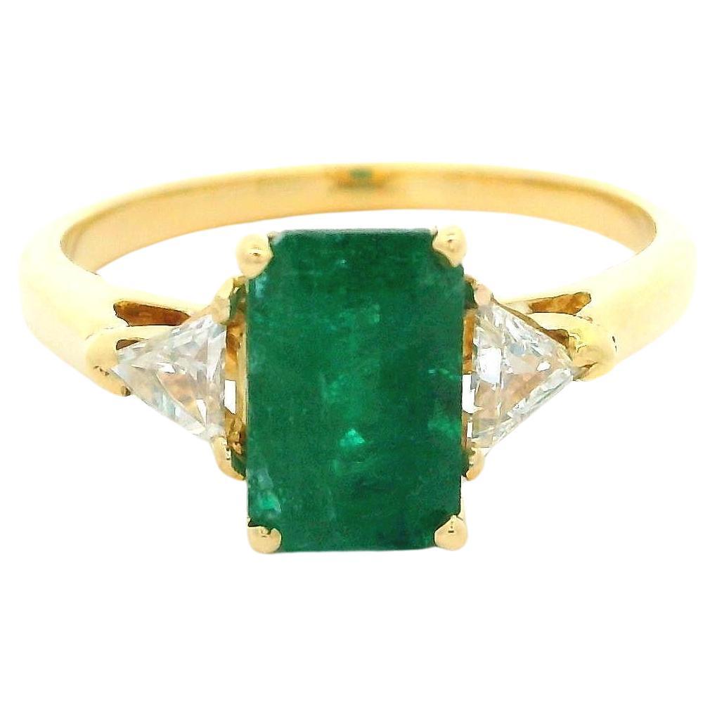 Elegant 18k Yellow Gold 2.30ctw Elongated Emerald & Trillion Diamond Ring