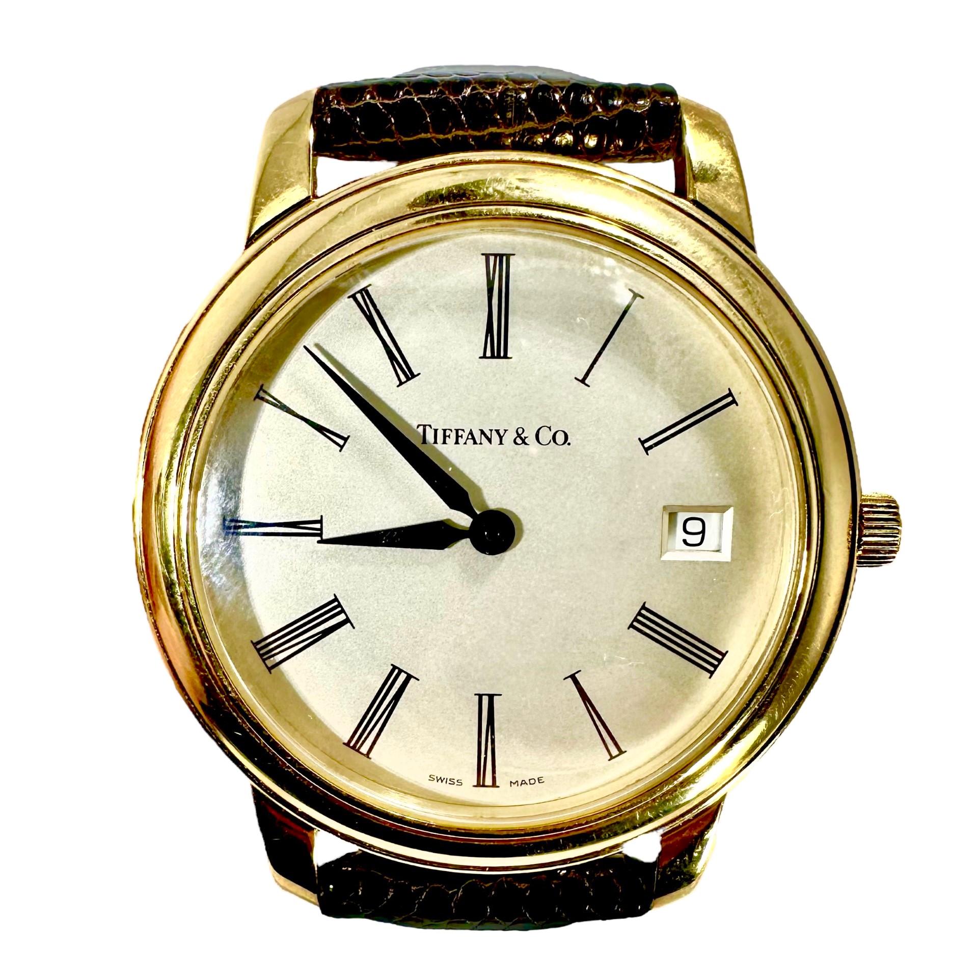 This truly classic Tiffany & Co. quartz movement men's wrist watch epitomizes the luxury and elegance that Tiffany is perennially associated with. It is large, measuring a full 1 1/2 inches in diameter and 1 3/4 inches from lug tip to lug tip. The