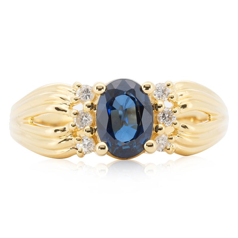 A beautiful ring with a dazzling Sapphire 1.00 carat natural Sapphire. It has Diamonds 0.06 carat of side diamonds which add more to its elegance. The jewelry is made of 18 kt. Yellow Gold with a high quality polish. It comes with NGI certificate