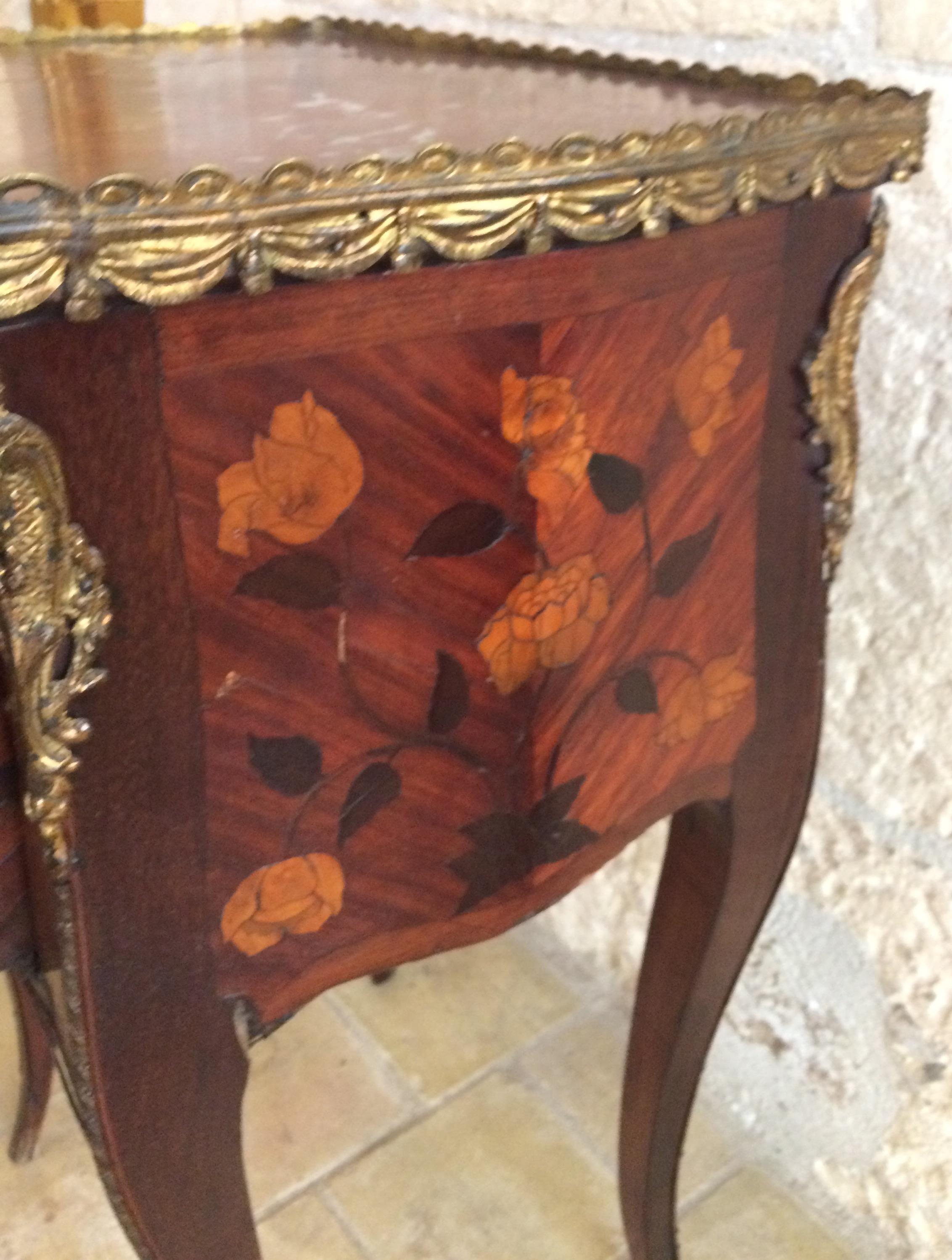 A very fine Louis XV French side table or nightstand with elegant marquetry work, all original unrestored.

This sumptuous side table has a distinctively shaped rectangular Brescia marble top with an attractive bronze mounted border. The body is