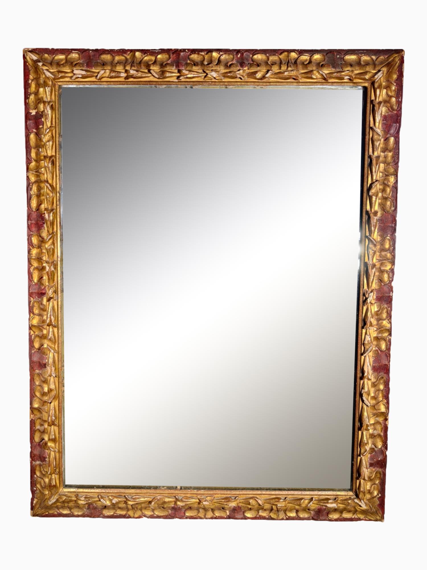 Enhance your space with this exquisite 18th-century French mirror, a stunning example of period craftsmanship. This elegant piece features its original frame and glass, showcasing the rich history and artistry of the time. The beautifully carved and