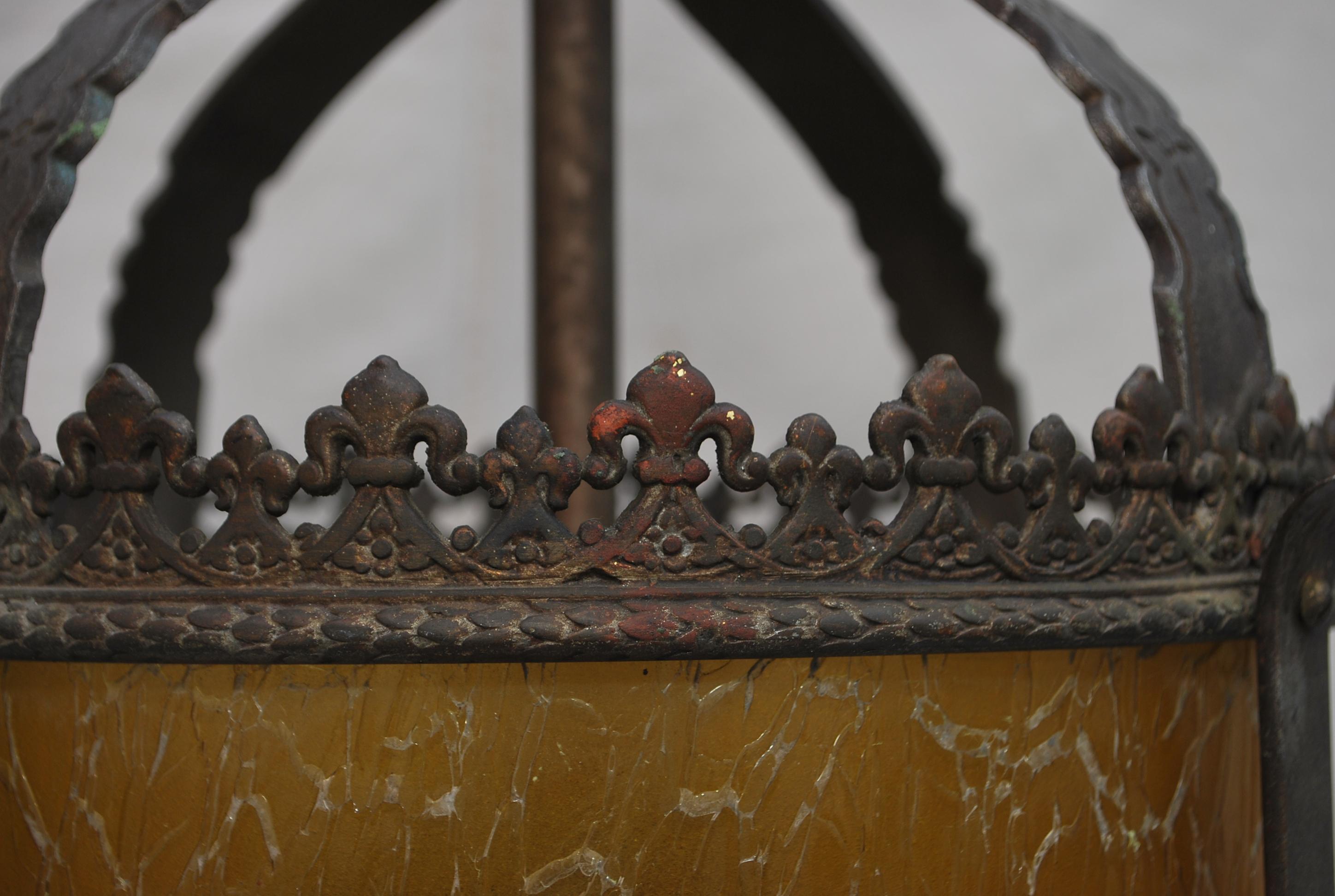 An elegant 1920's cast iron lantern, the patina and the color of the glass is so much nicer in person, sometimes I hate the flash, it can distort the true beauty of the antique