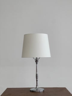 Elegant 1920s danish art deco table lamp in nickel and porcelain socket.