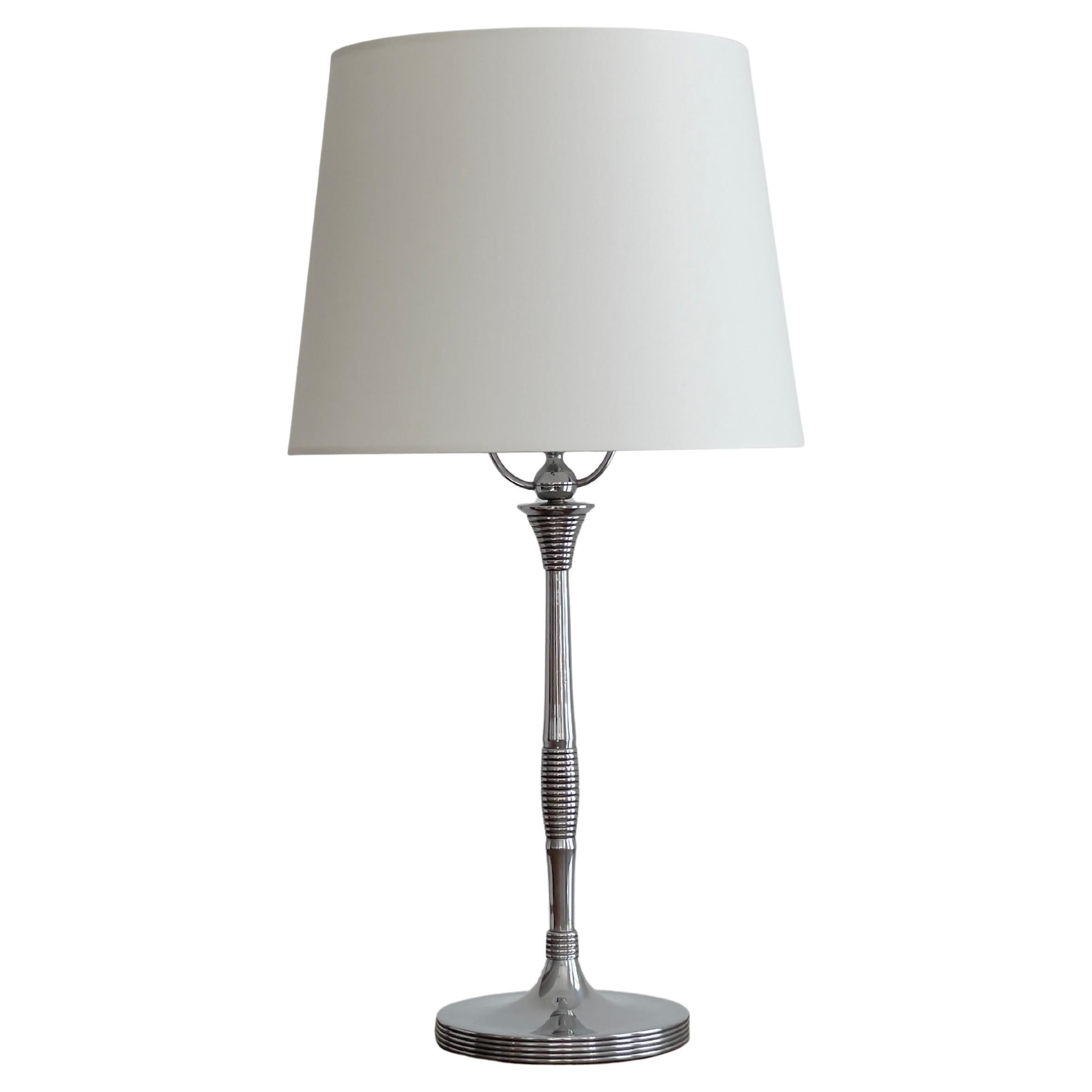 Elegant 1920s danish art deco table lamp in nickel and porcelain socket.