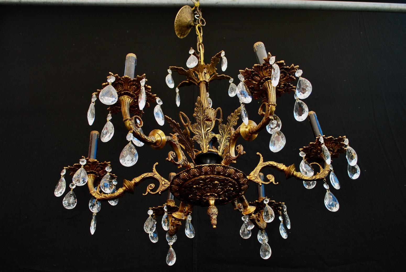 A beautiful and elegant brass chandelier from Spain, the patina is nicer in person.

  