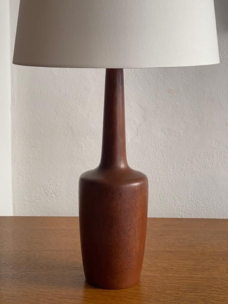 Scandinavian Modern Elegant 1940s danish modern table lamp in high quality solid teak wood. For Sale