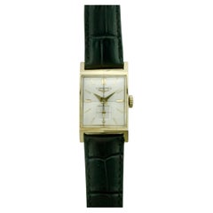 Elegante 1940er Longines Armbanduhr in 14k Gelbgold Seltenes facettiertes Kristall